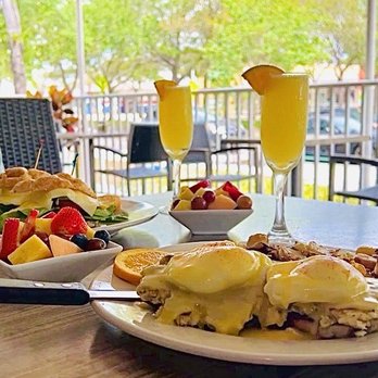 Benedict's Restaurant - Crab Cake Benedict with fruit, Avocado Egg Sandwich with fruit and Mimosas - Breakfast & Brunch Near Me - Largo, Florida Benedict's Restaurant - Crab Cake Benedict with fruit, Avocado Egg Sandwich with fruit and Mimosas - Breakfast & Brunch Near Me - Largo, Florida
