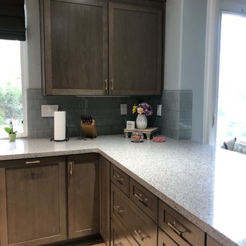 Castle Tile - We wanted the tile to wrap around the corner near the window (2" inset) and around the corner of the wall. - Flooring Near Me - Costa Mesa, California