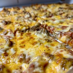 De Rango's Pizzeria - Cheese sausage, thin crust pizza with cheddar cheese added