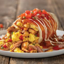 Village Inn - Smothered Breakfast Burrito, roasted chicken or smoked pork carnitas with potatoes, scrambled eggs, cheese, onion, tomato, corn + jalapenos