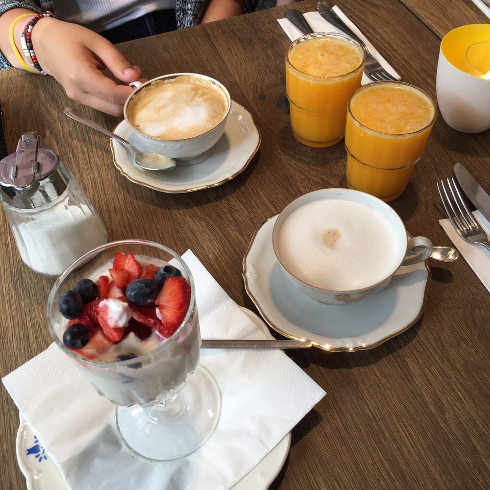 Sanseveria - Lattes, oj, and a yogurt parfait before our mains arrived - Bagels Near Me - Bruges, VWV Sanseveria - Lattes, oj, and a yogurt parfait before our mains arrived - Bagels Near Me - Bruges, VWV