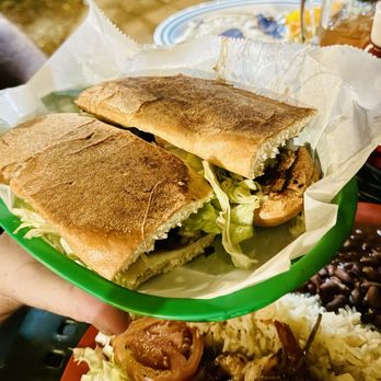 el carbonero - a person holding a plate of food - Salvadoran Near Me - Lake Worth, Florida el carbonero - a person holding a plate of food - Salvadoran Near Me - Lake Worth, Florida