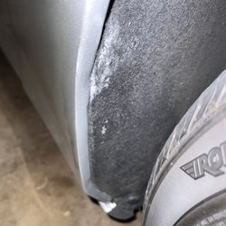 Caliber Collision - Paint from the vehicle that hit me under the fender. Also noticeable denting of fender.