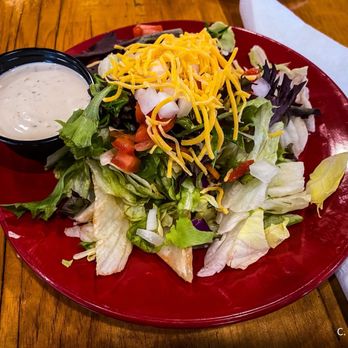 Goomba's Pizzeria - House Salad with Garlic Dressing - Pizza Near Me - Clermont, Florida Goomba's Pizzeria - House Salad with Garlic Dressing - Pizza Near Me - Clermont, Florida