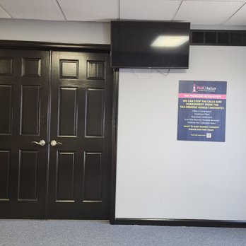 Pink Harbor, CPA - View of main lobby office doors with TV and sign at Pink Harbor, CPA - Tax Services Near Me - Williamstown, New Jersey Pink Harbor, CPA - View of main lobby office doors with TV and sign at Pink Harbor, CPA - Tax Services Near Me - Williamstown, New Jersey