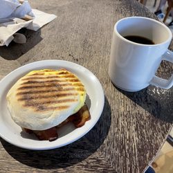 Black Cap Coffee & Beer - Egg with cheese and bacon on an English muffin.  Small cup o' Joe.