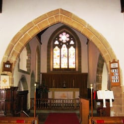 The Parish Churchof St Peter and St John the Baptist - Chancel arch with chancel beyond. The low arch behind the pulpit may have been an Easter Sepulchre.