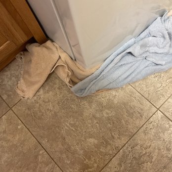 Sears Appliance Repair - Towels soaking up water coming out the front of the Kenmore refrigerator. - Appliances & Repair Near Me