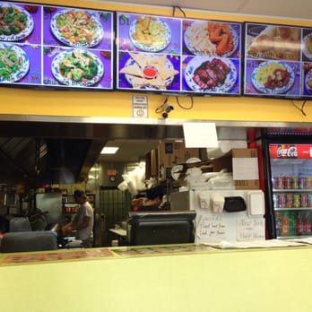 Panda New York Style - Front of counter...menu pics change up on the screens to show off the dishes. - Chinese Near Me - Lawrenceville, Georgia