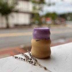 Haus Cafe - This is our Vietnam-Me latte w/ Ube cold foam. Condensed milk, double espresso, balanced with your milk preference, topped w/ Ube cold foam.