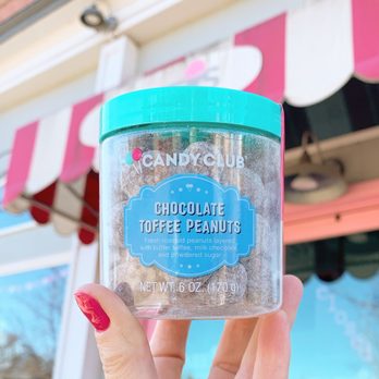 Sweets Ice Cream - a hand holding a container of candy club chocolate toffee peanuts - Ice Cream & Frozen Yogurt Near Me - Erie, Colorado Sweets Ice Cream - a hand holding a container of candy club chocolate toffee peanuts - Ice Cream & Frozen Yogurt Near Me - Erie, Colorado