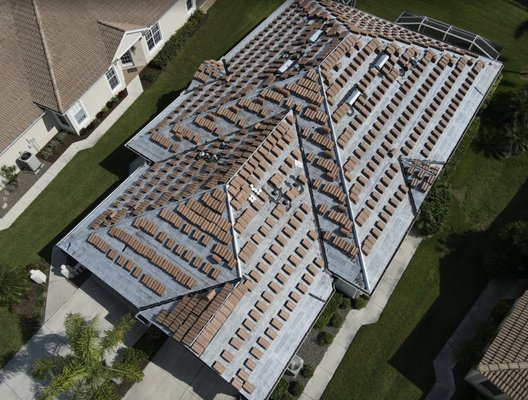 Coastal Roofing And Gutters Logo