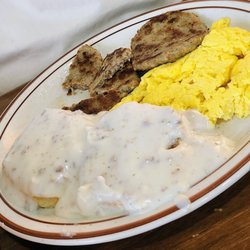Leo's Family Restaurant - Biscuits and gravy platter, with sausage patties and scrambled eggs.