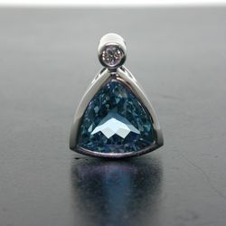 Olufson Designs - Aquamarine bezel set with a diamond over the bail...just waiting to be worn around the neck.