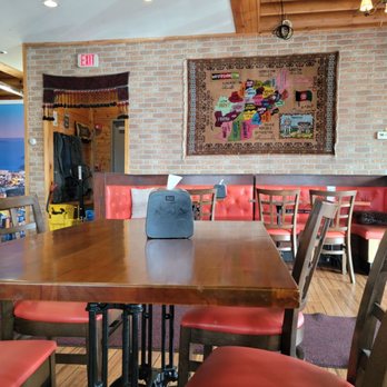 Aria Kabab - a dining area with red chairs - Afghan Near Me - Colonie, New York