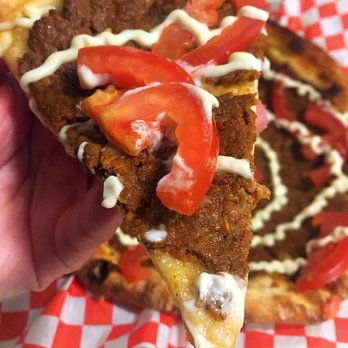 Man'oushe Express - A slice of sujuk flatbread - spicy beef sausage, tomato, garlic aioli - Pizza Near Me - Seattle, Washington Man'oushe Express - A slice of sujuk flatbread - spicy beef sausage, tomato, garlic aioli - Pizza Near Me - Seattle, Washington