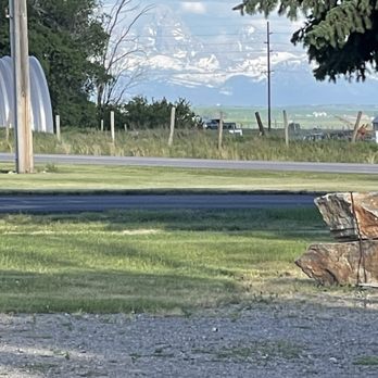 Ashton Log Cabins - View of Tetons from parking - Guest Houses Near Me - Ashton, Idaho