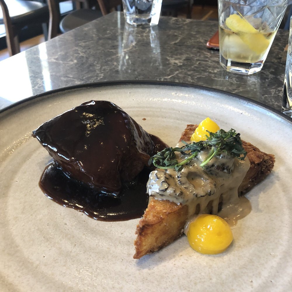 Hexagon - Braised short rib beef with a very crispy, deep fried potato rosti with morel sauce and egg yolk. - French Near Me - Oakville, Ontario Hexagon - Braised short rib beef with a very crispy, deep fried potato rosti with morel sauce and egg yolk. - French Near Me - Oakville, Ontario