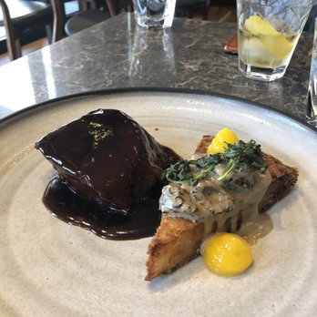 Hexagon - Braised short rib beef with a very crispy, deep fried potato rosti with morel sauce and egg yolk. - French Near Me - Oakville, Ontario Hexagon - Braised short rib beef with a very crispy, deep fried potato rosti with morel sauce and egg yolk. - French Near Me - Oakville, Ontario