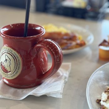 Another Broken Egg Cafe - a cup of coffee and a plate of pancakes - Breakfast & Brunch Near Me - College Station, Texas Another Broken Egg Cafe - a cup of coffee and a plate of pancakes - Breakfast & Brunch Near Me - College Station, Texas