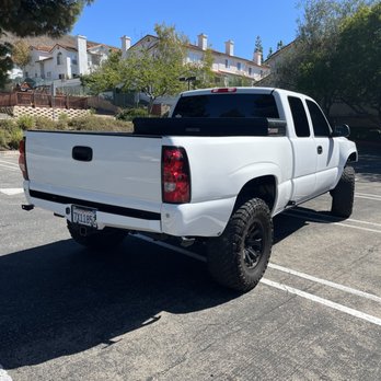 Enhanced Certified Collision Center - Raptor liner on top of painted bumper - Body Shops Near Me - San Luis Obispo, California Enhanced Certified Collision Center - Raptor liner on top of painted bumper - Body Shops Near Me - San Luis Obispo, California