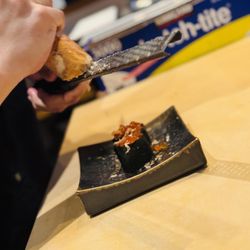 Kumi Sushi - Shaving some ankimo on the top ikura