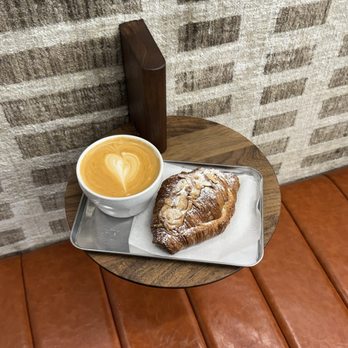 Ansa Coffee - oatmilk latte and almond croissant - Coffee Roasteries Near Me - New York, New York