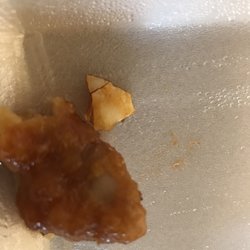 Joyous Chinese Restaurant - egg shell that was on piece of orange chicken.