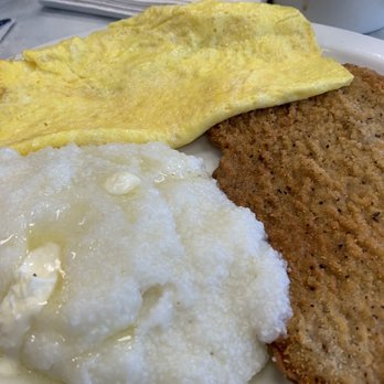 Bob & Edith's Diner - Chicken Fried Steak, buttered grits and an omelette. Gravy was on the side. One foot in da grave here - American Near Me - Arlington, Virginia
