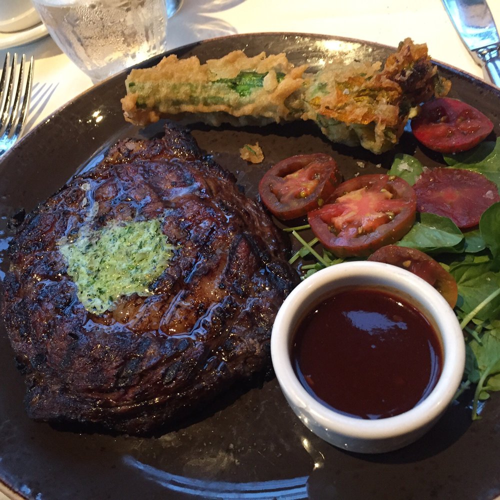Buckeye Roadhouse - Rib eye with ricotta stuffed squash blossoms and heirloom tomatoes :) - American Near Me - Mill Valley, California Buckeye Roadhouse - Rib eye with ricotta stuffed squash blossoms and heirloom tomatoes :) - American Near Me - Mill Valley, California