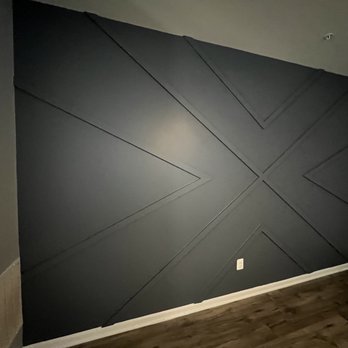Fence & Carpet Solutions - a room with a black painted wall - Carpet Installation Near Me Fence & Carpet Solutions - a room with a black painted wall - Carpet Installation Near Me