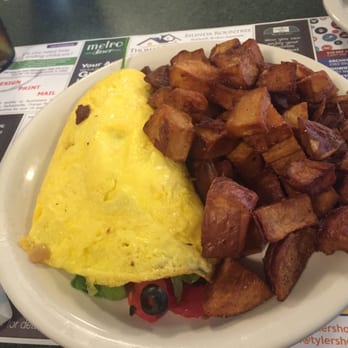 Metro Diner - Come on, the has to be 3 whole potato son that plate. The Greek omelet was super good! - Diners Near Me - Gainesville, Florida