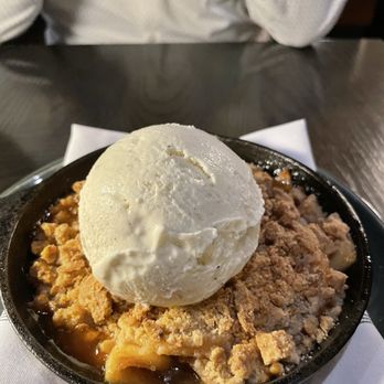 Grist - Apple crisp dessert with huge scoop of ice cream! Delicious! - Breakfast & Brunch Near Me - Honeoye Falls, New York Grist - Apple crisp dessert with huge scoop of ice cream! Delicious! - Breakfast & Brunch Near Me - Honeoye Falls, New York