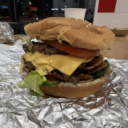 a hamburger with cheese and lettuce