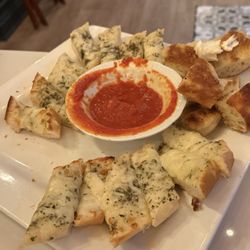 Gourmet Italian Cuisine - Garlic cheesy bread. Sorry i ate some of it.  But the entire plate was full of bread for $6.50