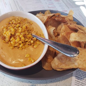 The Rim - Their chips and queso. Homemade potato chips and the queso is very processed cheesy, with corn. It was weird, but not bad. - Wine Bars Near Me - Fort Worth, Texas The Rim - Their chips and queso. Homemade potato chips and the queso is very processed cheesy, with corn. It was weird, but not bad. - Wine Bars Near Me - Fort Worth, Texas