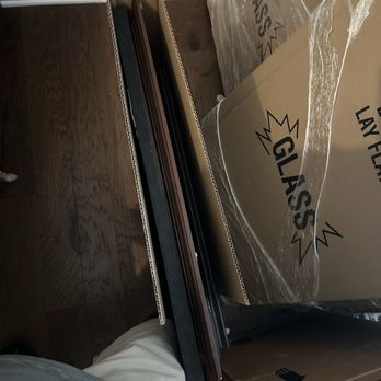 Ivy League Moving Services - Pictures crammed in boxes with no protection - Movers Near Me Ivy League Moving Services - Pictures crammed in boxes with no protection - Movers Near Me