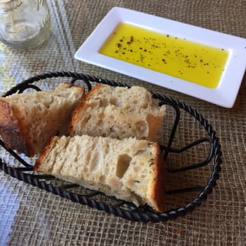 Lento Restaurant - Delicious fresh bread with olive oil and fresh ground black pepper. - New American Near Me - Rochester, New York