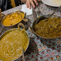Momo N Curry - Chicken tikka, bengan bharta, and goat curry