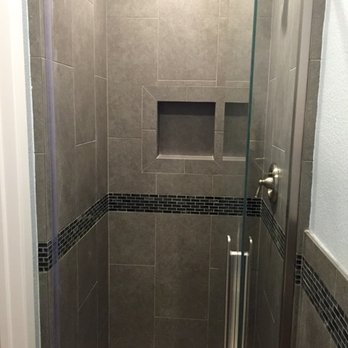 GGR Design + Remodeling - They built this shower from scratch - with a custom shower pan, soap niche, wainscoting and a perfectly assembled glass door. - General Contractors Near Me - Poway, California