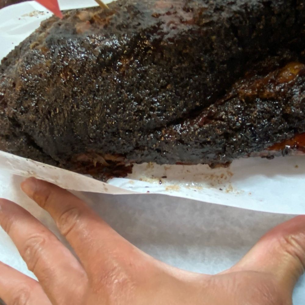 Louie Mueller Barbecue - Flinstone's size ribs. Bigger than my hand. And I'm a fairly big size guy myself. - Barbeque Near Me - Taylor, Texas Louie Mueller Barbecue - Flinstone's size ribs. Bigger than my hand. And I'm a fairly big size guy myself. - Barbeque Near Me - Taylor, Texas