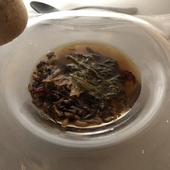 Alinea - LEAVES | Roasted onion tea poured over Fromage d'affinois with puffed wild rice, red quinoa, crisp Napa cabbage and pickled onion - New American Near Me - Chicago, Illinois