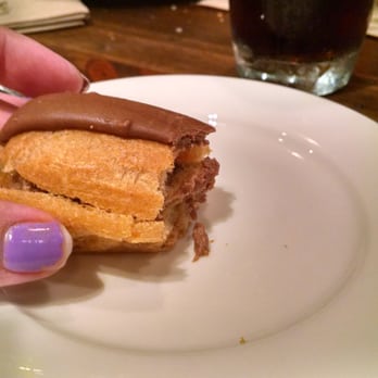la Madeleine - Complementary eclair, and a slice of their chocolate and raspberry cake after a VERY disappointing meal. - Bakeries Near Me - Austin, Texas la Madeleine - Complementary eclair, and a slice of their chocolate and raspberry cake after a VERY disappointing meal. - Bakeries Near Me - Austin, Texas