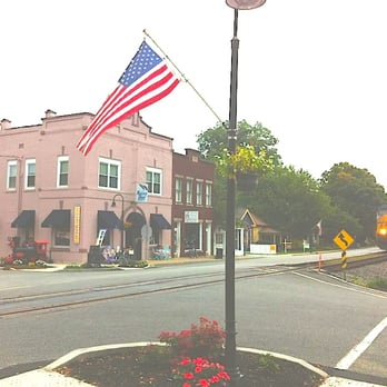Rainy Day Resale - A view of our corner of Main Street with the train approaching. - Women's Clothing Near Me - La Grange, Kentucky Rainy Day Resale - A view of our corner of Main Street with the train approaching. - Women's Clothing Near Me - La Grange, Kentucky