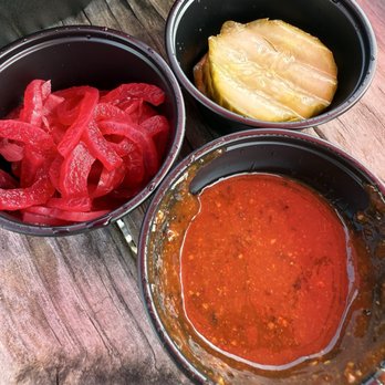 North Texas Smoke - Homemade pickles, pickled onions, and one of their many sauces. - Barbeque Near Me - Decatur, Texas North Texas Smoke - Homemade pickles, pickled onions, and one of their many sauces. - Barbeque Near Me - Decatur, Texas
