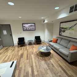 The Thomas Hotel - The living area has an incredible Nespresso espresso maker, a nice refrigerator, a big microwave, and an excellent TV on the wall.