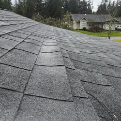 RnR General Construction - Uneven shingles, with a dip where water has been collecting.