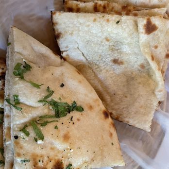 Taj of India Cuisine - Garlic and cheese naan - Indian Near Me - Washington, DC, District of Columbia