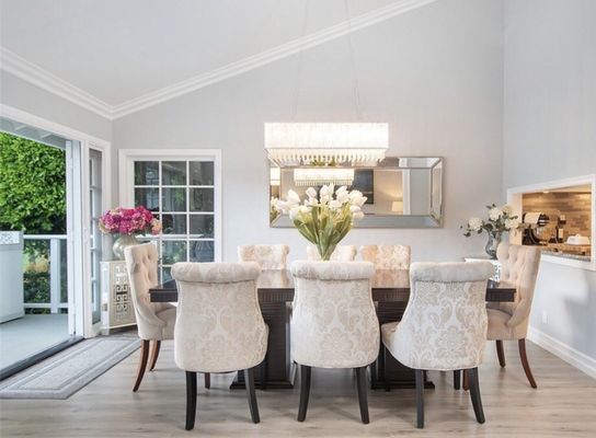 Dining Room Restoration - This home experienced major water damage in the kitchen, spreading devastating damage throughout the dining room. The entire dining room was gutted in this full-scale restoration project. The redesigned space was updated with modern and bright elements for a dramatic transformation.