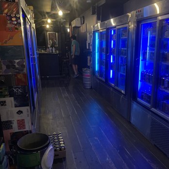 Beer Run - a row of coolers with blue lights - Beer Bar Near Me - New York, New York